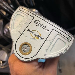 Ray Cook Gyro sm golf putter in right hand 
Used